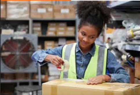 Warehouse worker preparing packages for bulk pickup delivery